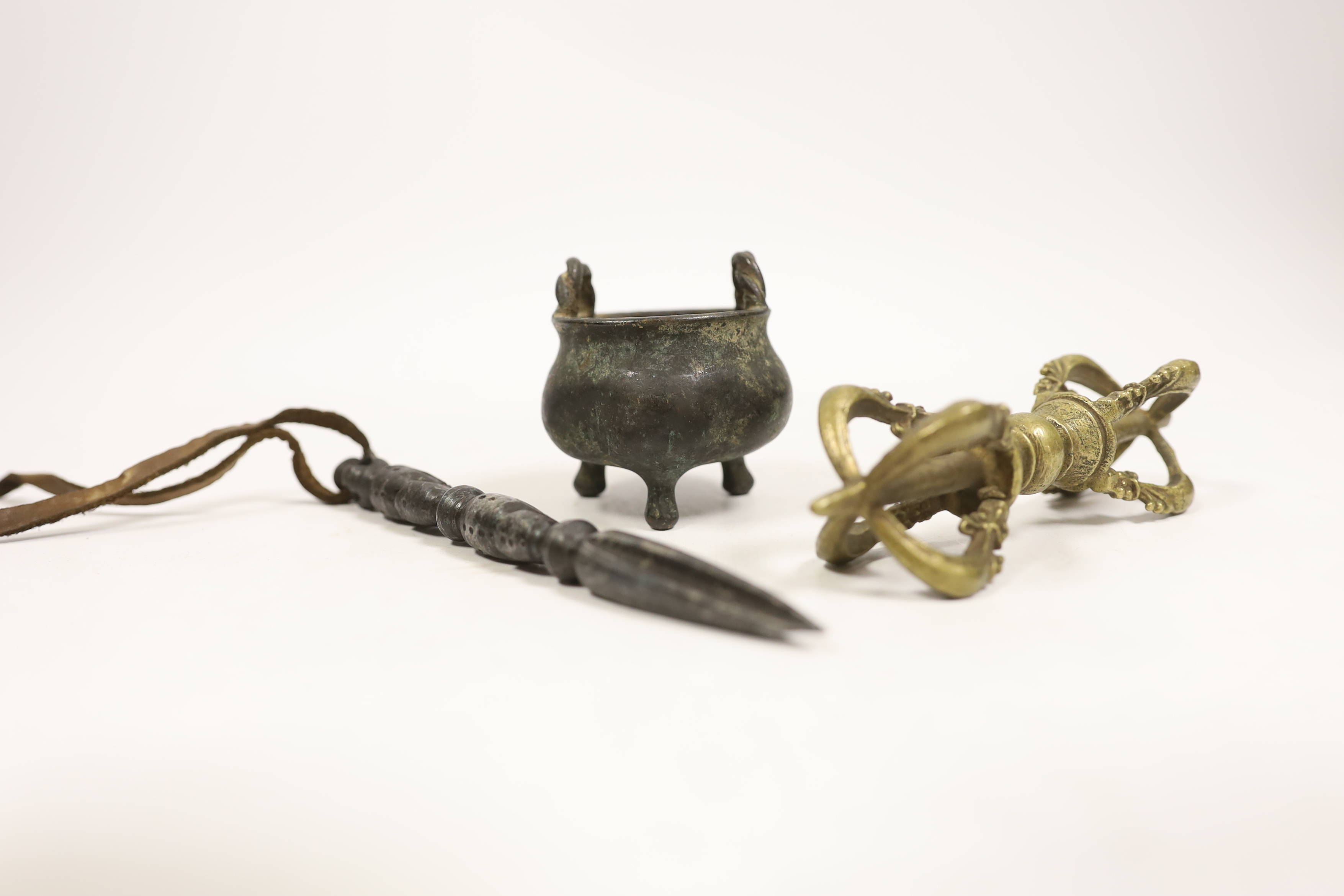 Three Chinese Tibetan metal wares including a miniature cauldron, a knife rest, etc.